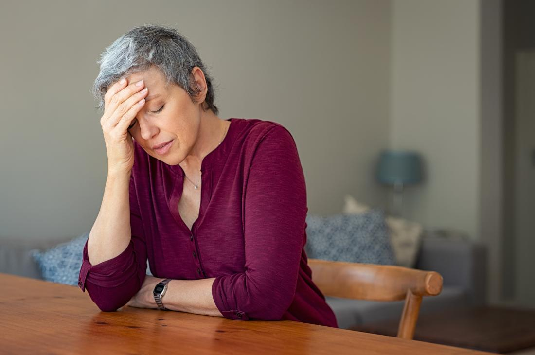 <img src="types of diabetic emergency.png" alt="an elderly white woman in a wine-colored top, seated on a wooden chair, wearing a worried face, looking down with eyes closed, with her left arm on a wooden table, and her right arm placed on her forehead"> 